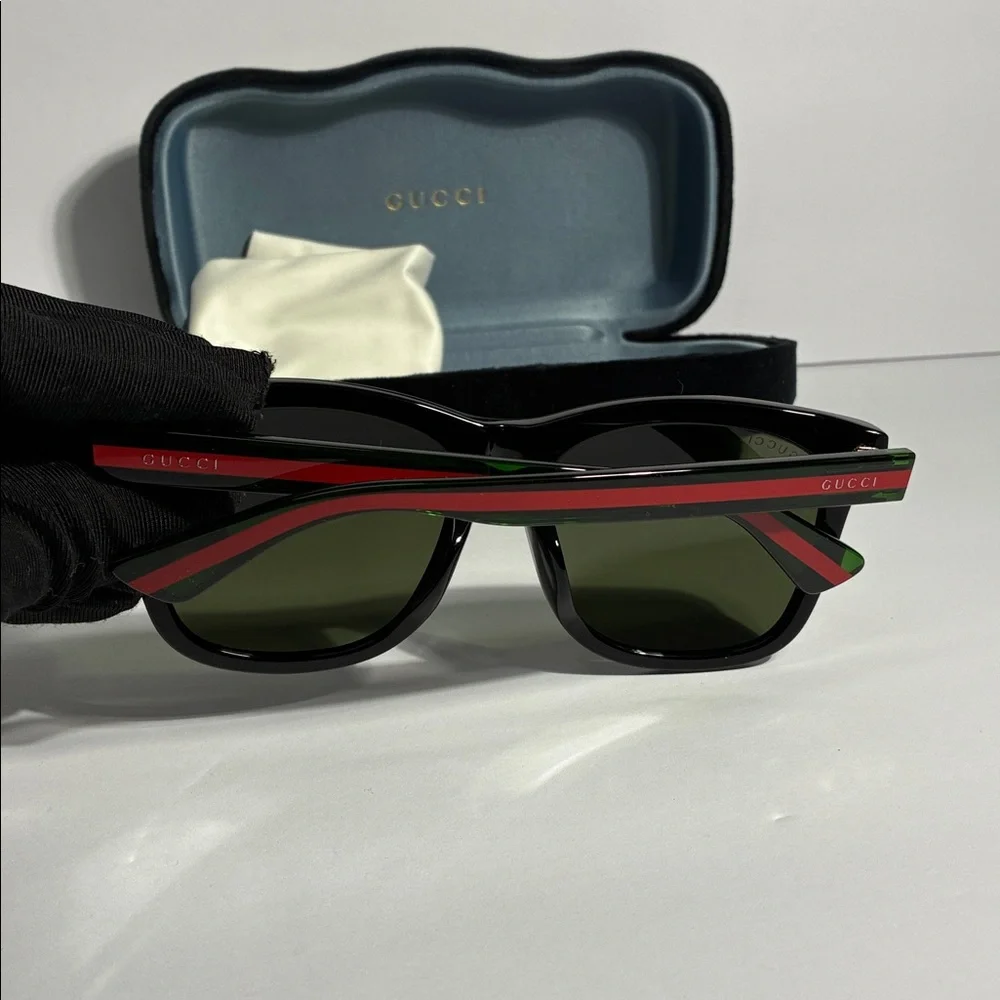 New Authentic GG0057SKN 002 Gucci Black Sunglasses with Green Lenses